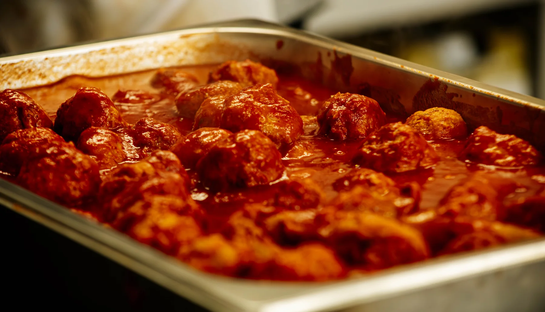 A tray of Big Carm’s meatballs in tomato sauce, ready for catering