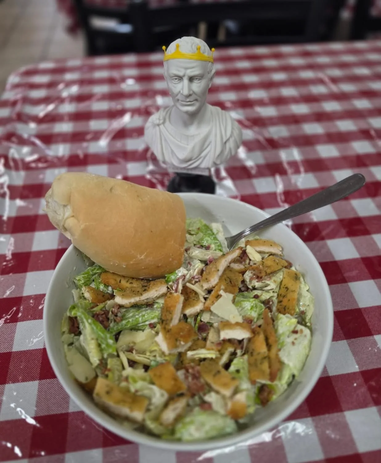 A chicken Caesar salad prepared at Big Carm’s
