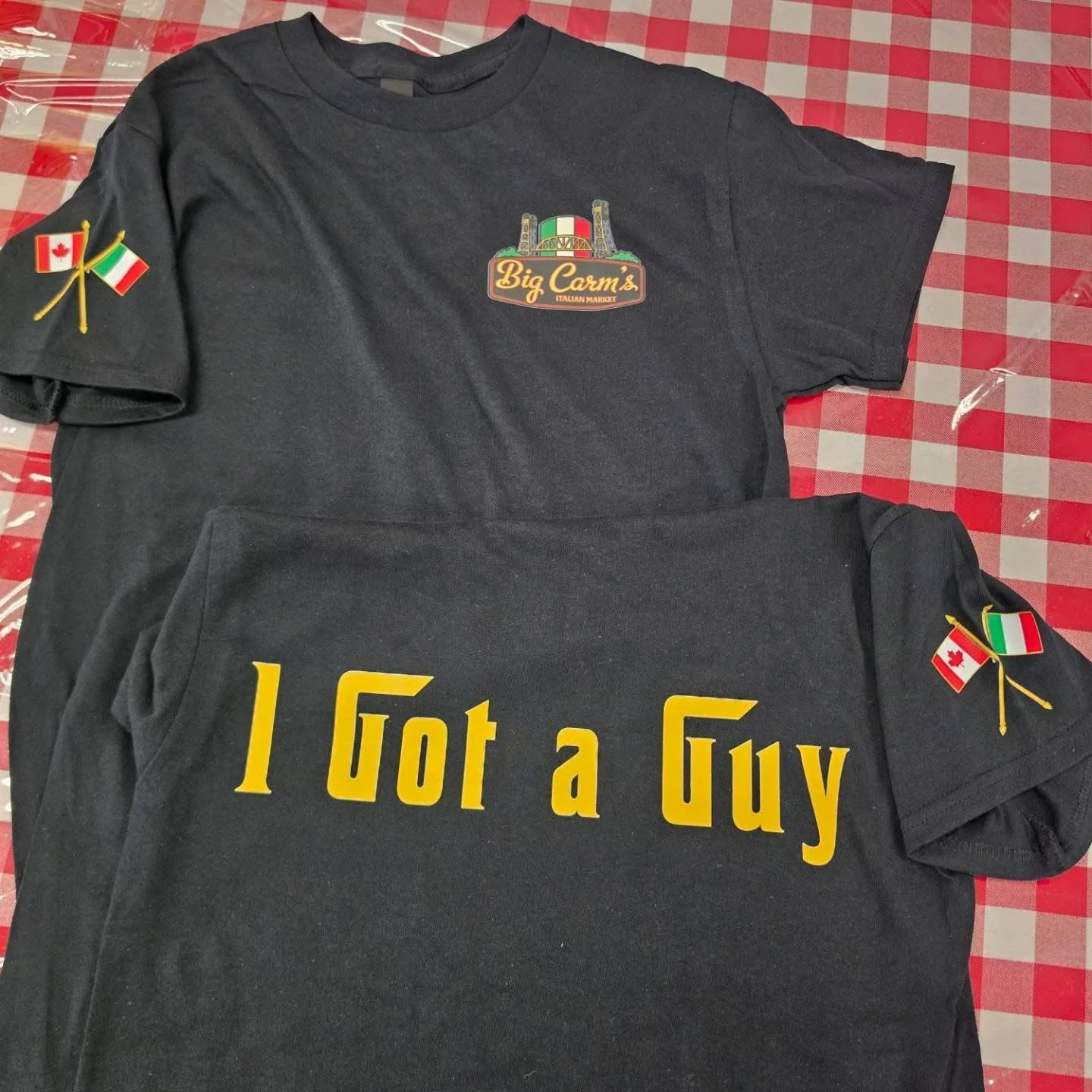 Big Carm’s black T-shirt with Italian and Canadian flag details